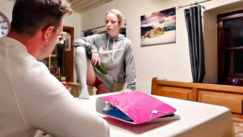 German teen in hoodie teases with cucumber near stepbro