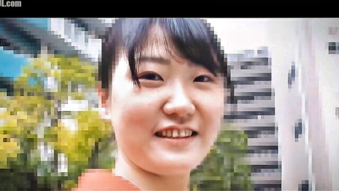 Cute smiling Asian babe with bangs flashing teeth on sunny balcony