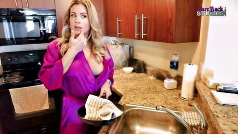 Blonde MILF Coco Vandi in open pink robe showing cleavage