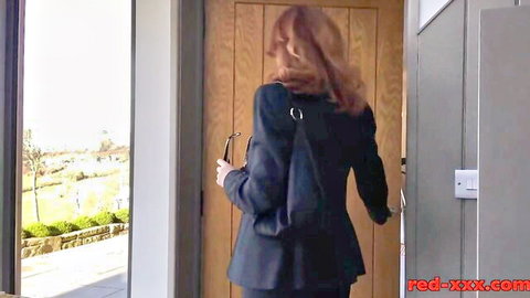 Redhead tourist in suit entering door, teasing strip poker vibe