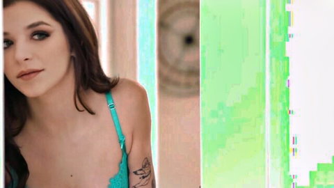 Jade Maris in teal lingerie teasing cleavage in steamy lesbian scene