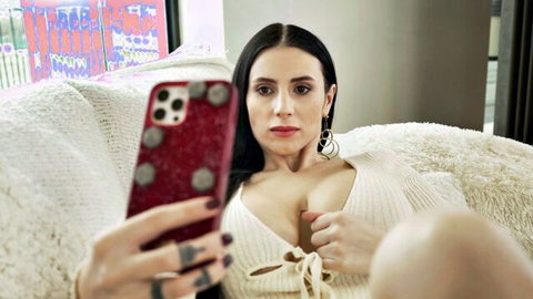 Nelly Kent in low-cut sweater cleavage selfie with Raul Costa