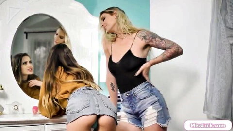 Brooke Banner bends over with friends in bathroom, denim shorts tease