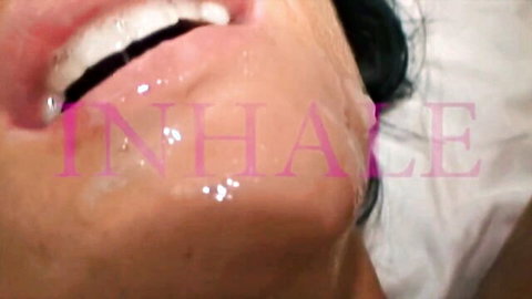 Close-up of brunette woman inhaling poppers with glossy lips in steamy action