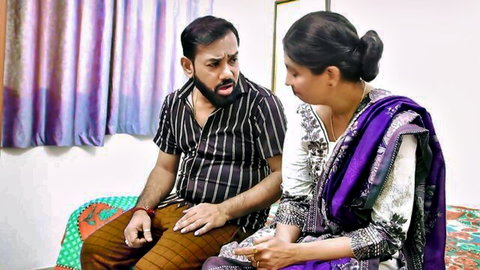 Desi woman in saree sits with man in steamy Indian couple preview