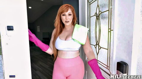 Curvy redhead MILF teases with huge tits spilling from white sports bra and tight pink leggings while wearing long green rubber gloves
