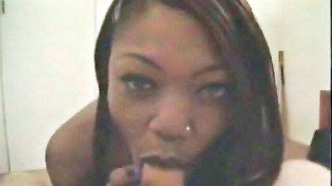 Kinky ebony with long tongue teases thick toy in close-up oral action