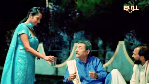 Indian BBW in blue salwar serving drink to two men in outdoor threesome setup