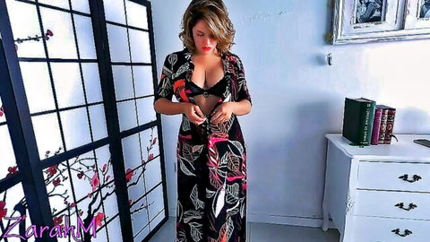 Fit brunette MILF teasing in open floral robe and black lace bra