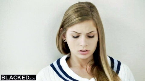 Sydney Cole in schoolgirl sweater, blonde teen looking down mouth open
