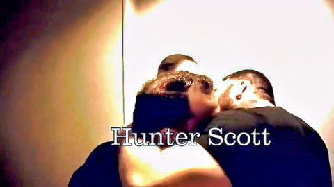 Hunter Scott embracing muscular man in intimate gay moment