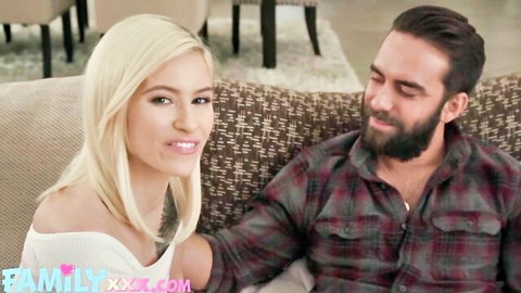Kiara Cole smiles intimately with handsome bearded man on couch