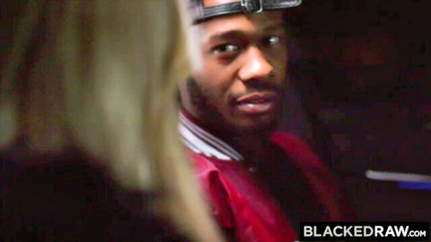 Caitlin Bell's blonde curves tease Anton Harden's intense gaze in Blacked Raw