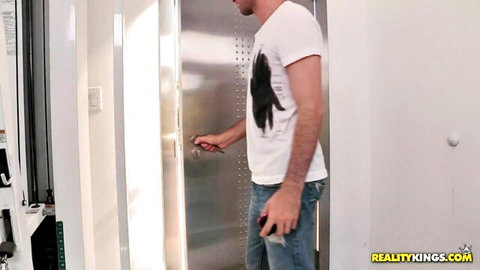 James Deen opening gym locker room door in casual wear