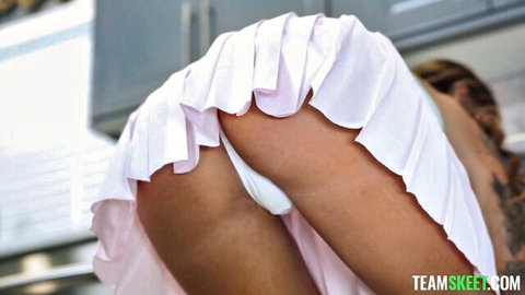Charlotte Mae bent over in pink skirt with panties aside exposing ass and pussy