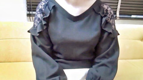 Sexy Asian beauty in lace-trimmed black top teasing softly