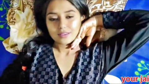 Seductive Indian wife in black top, teasing neck touch on bed