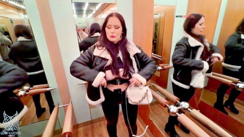 Leni Luchs poses seductively in black leather jacket and fur trim