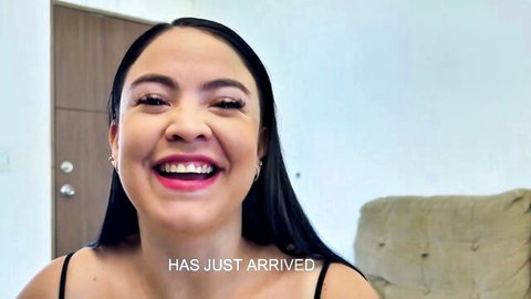 Angelica Gomez smiling in spaghetti strap top, arriving for steamy action