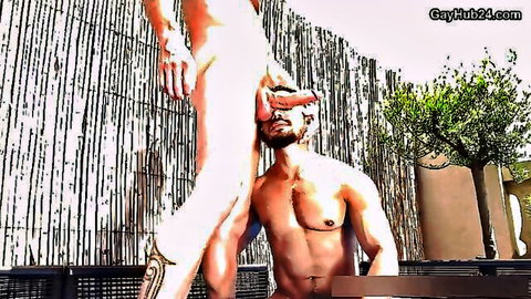 Bearded muscular hunk kneels with massive erect cock in his face for gay blowjob outdoors