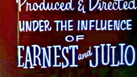 Vintage porn title screen 'Produced & Directed Under the Influence of Earnestest & Juliuo' neon sign