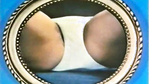 Vintage close-up of woman's bare hairy buttocks with white panties pulled down in ornate frame