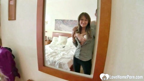 Amateur babe flashing perky tits and nipples in hotel mirror selfie with man behind her