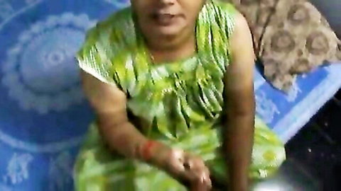 Indian aunty in green dress teasing with oily handjob skills