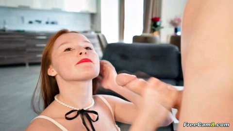 Redhead freckled babe strokes big hard cock with hand, mouth open ready for blowjob on webcam