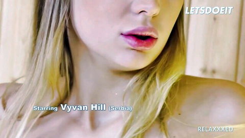 Serbian blonde Vyvyan Hill puckers glossy wet lips seductively closeup