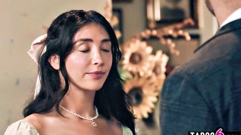 Brunette beauty in white bridal gown gazes coyly at suited stepdad in taboo encounter