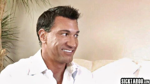 Handsome smiling DILF stepdad in open white shirt exposing chest on couch