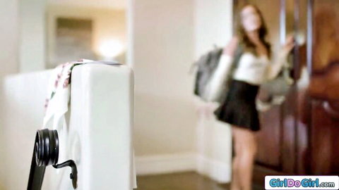 Kendra James in short skirt and blouse, teasing in doorway threesome preview
