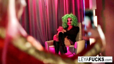 Harley Quinn cosplay with big tits and ass in seductive chair pose