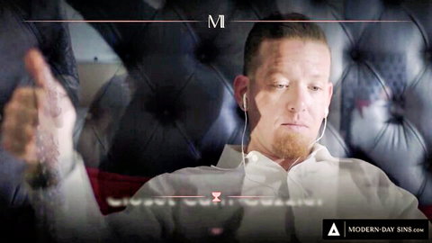 Handsome man in white shirt and headphones gives thumbs up on velvet couch Modern Day Sins promo
