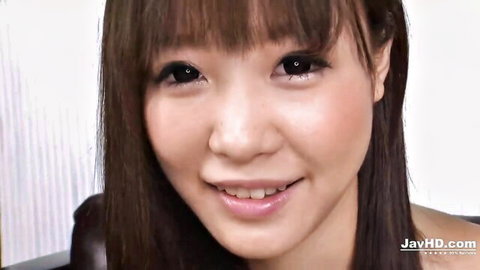 Momoka Rin smiling seductively in white lingerie, JAV close-up