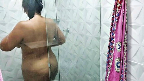 Naked curvy Indian woman with big ass showering nude from behind in steamy glass shower