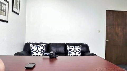 Dani's anal casting setup: couch, table with camera and phone