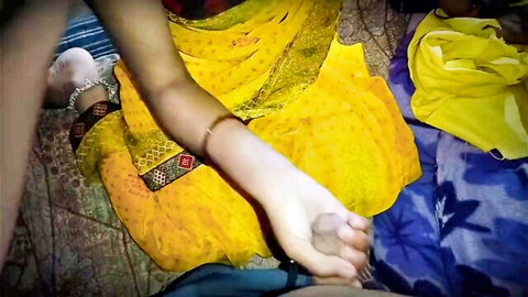 Indian woman in yellow saree gripping hard cock with hand for amateur handjob
