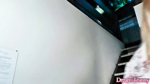 Bella Atrix in white dress ascending stairs, teasing solo play vibe