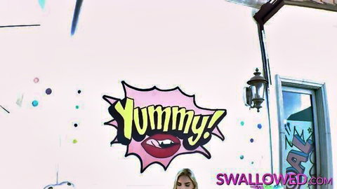 Yummy pink graffiti explosion with red lips on wall promoting blowjob cum swallow videos on swallowed.com