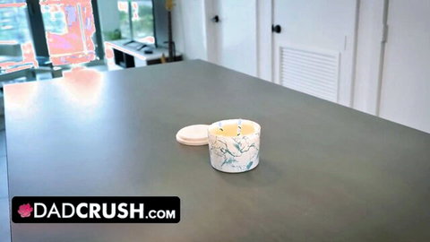 Dadcrush candle jar on gray kitchen counter with site watermark