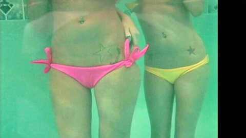 Jenna Presley and friend in sexy pink and yellow bikinis poolside, star tattoos