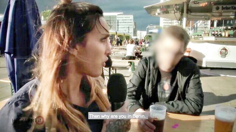 Sophie Logan chats with stranger in Berlin during swinger setup