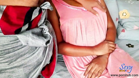 Shy ebony girl in pink lingerie with husband in intimate bed scene