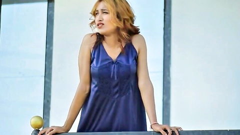Curvy Indian woman in sexy blue satin nightgown, home servant theme