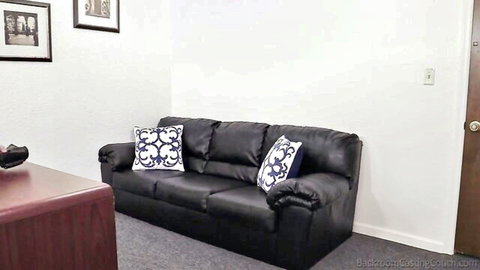 Empty office casting couch setup with black leather sofa ready for teen big tits anal casting