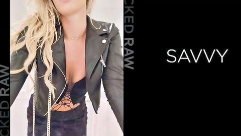 Blonde babe in open leather jacket flashing deep cleavage and lace bra tits tease