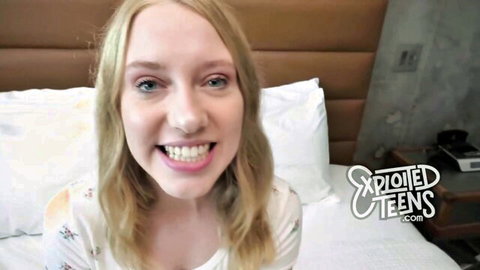Smiling blonde teen babe in off-shoulder top on bed teasing for rough sex