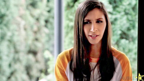 Mackenzie Moss seductive closeup in orange top, skinny brunette teen